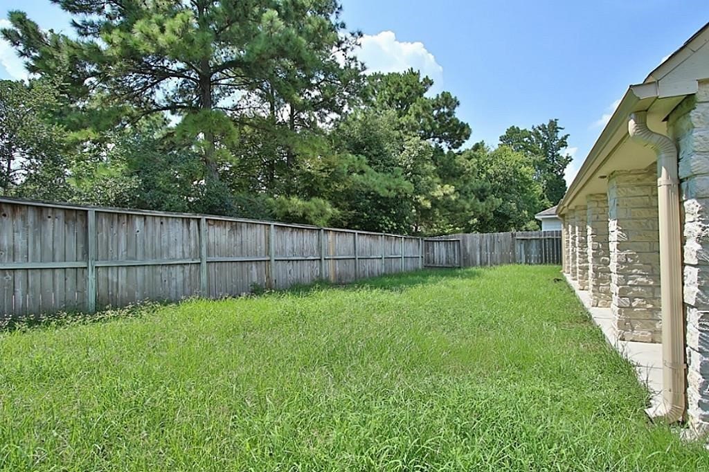 28511 Cory Terrace Court Spring, TX 77386 - Photo 31 of 31 a view of a backyard with a garden