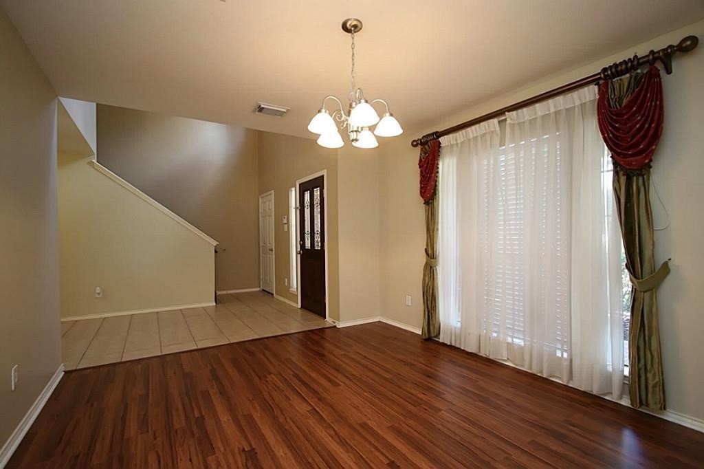 28511 Cory Terrace Court Spring, TX 77386 - Photo 8 of 31 a view of a livingroom with wooden floor and a ceiling fan