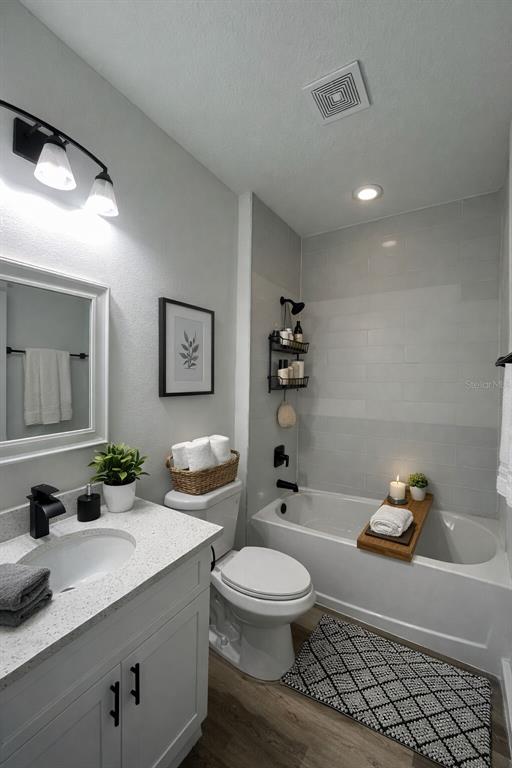 4655 Southwest 139th Lane Ocala, FL 34473 - Photo 12 of 15 a bathroom with a granite countertop toilet sink and mirror