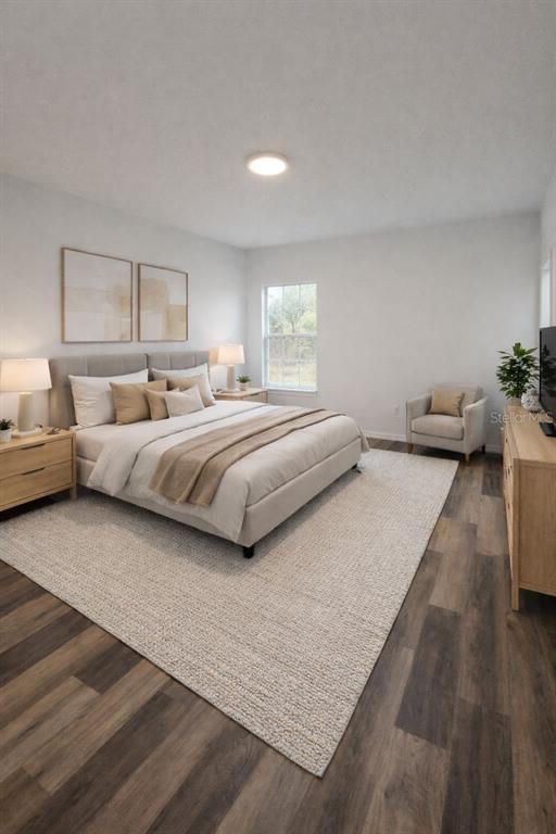 4655 Southwest 139th Lane Ocala, FL 34473 - Photo 6 of 15 a bedroom with bed and window