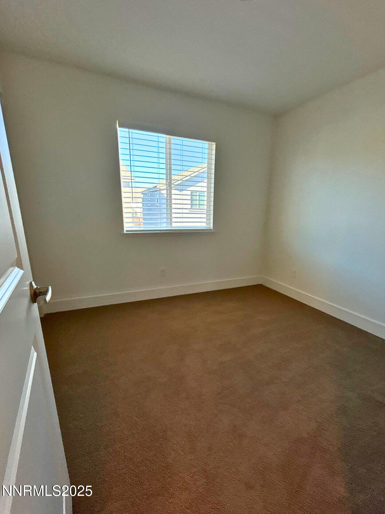 7976 Corundum Drive Sparks, NV 89436 - Photo 16 of 19 an empty room with a window