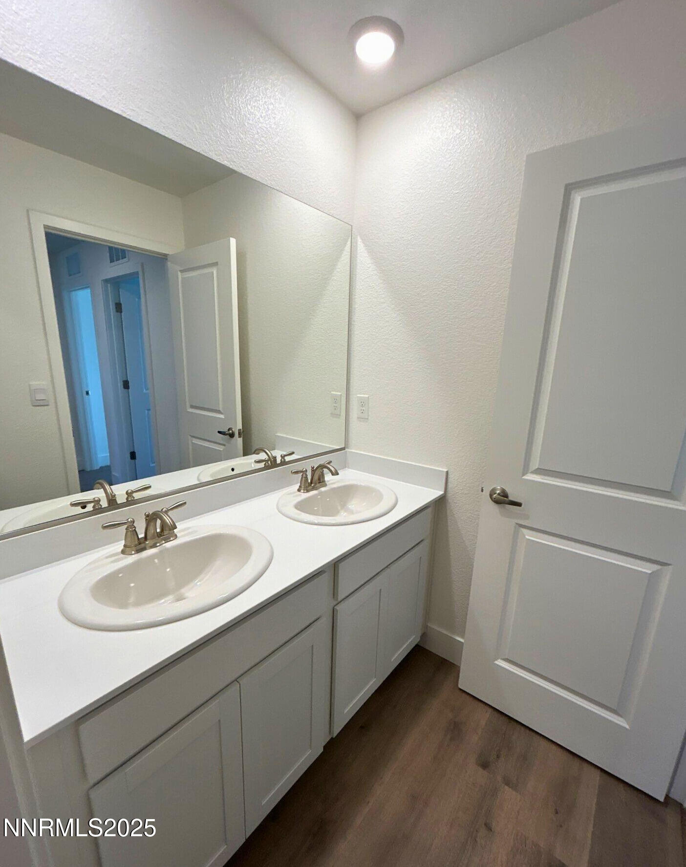 7976 Corundum Drive Sparks, NV 89436 - Photo 17 of 19 a bathroom with a sink and a mirror