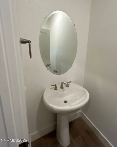 a bathroom with a sink and mirror