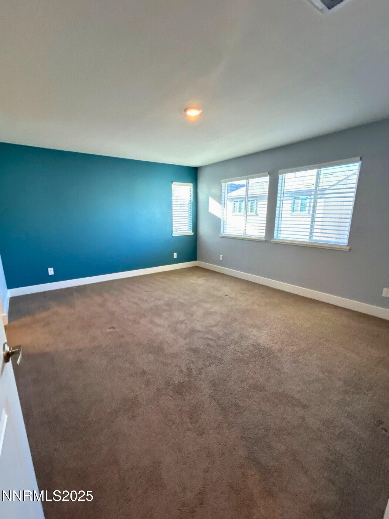 7976 Corundum Drive Sparks, NV 89436 - Photo 8 of 19 an empty room with windows and closet