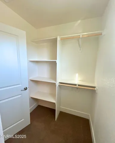 a view of an empty walk in closet