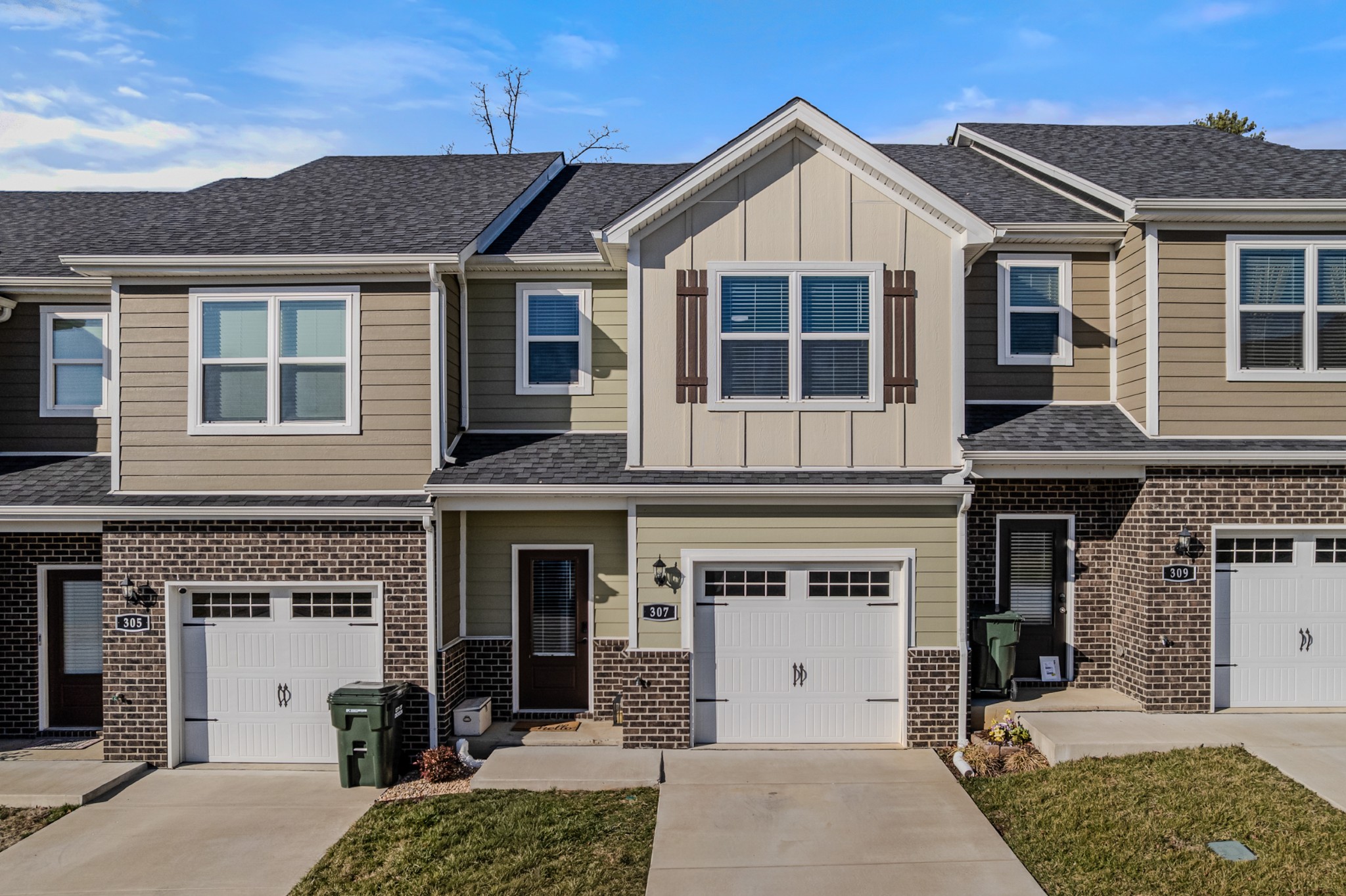 a front view of a house with a yard