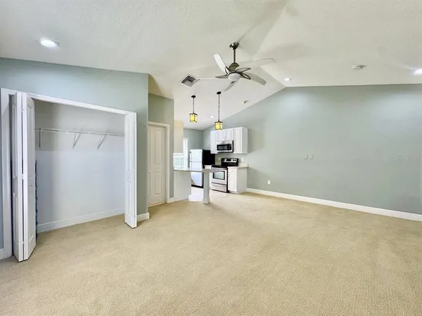 a view of a livingroom with a kitchen