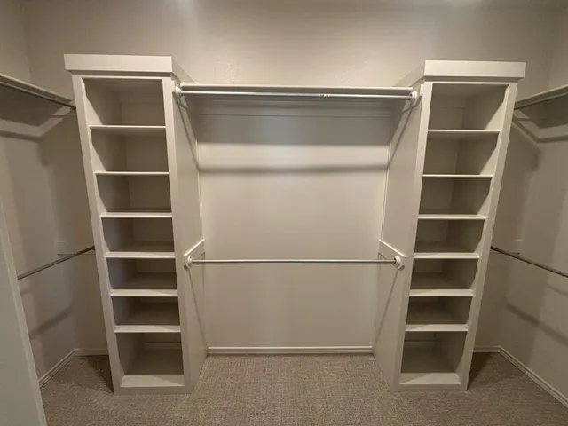 a view of an empty walk in closet