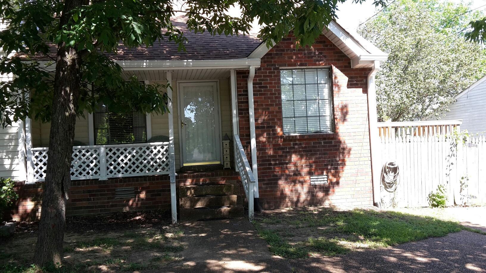3227 Anderson Road Antioch, TN 37013 - Photo 1 of 16 a front view of a house with a yard