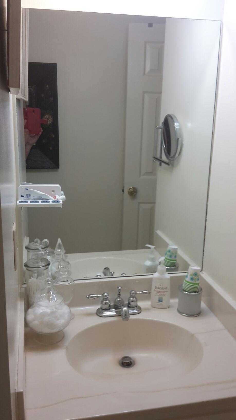 3227 Anderson Road Antioch, TN 37013 - Photo 13 of 16 a bathroom with a sink and a mirror