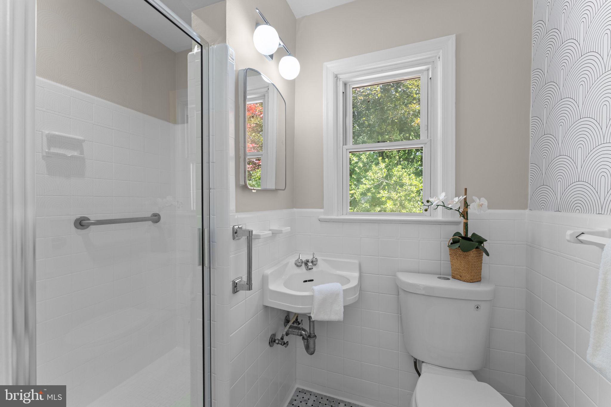 11712 Berwick Road Silver Spring, MD 20904 - Photo 15 of 42 a bathroom with a sink a toilet and a mirror