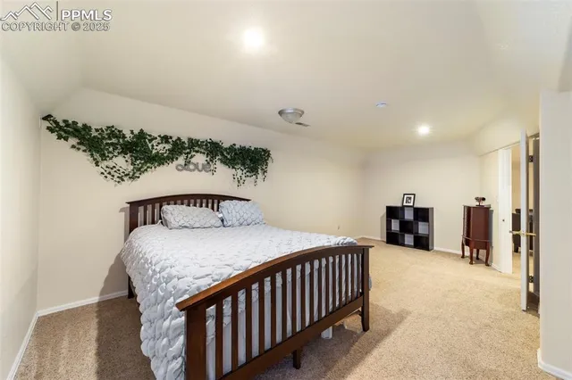 a bedroom with a bed and a view of bathroom