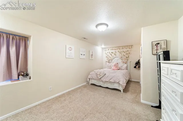 a bed room with a bed and a window