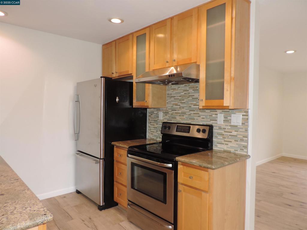 1919 Ygnacio Valley Road Walnut Creek, CA 94598 - Photo 6 of 35 a kitchen with stainless steel appliances a refrigerator and a stove