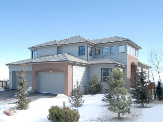563 Ridgeside Drive Golden, CO 80401 - Photo 1 of 1 a front view of a house with a yard