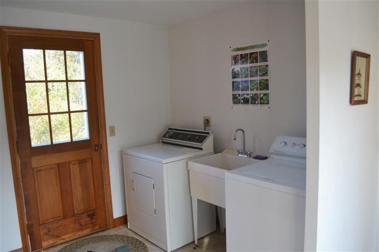 460 Summit Avenue Eastham, MA 02642 - Photo 11 of 25 a view of storage and utility room with washer and dryer