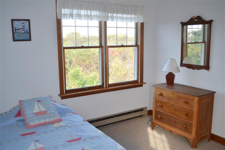 460 Summit Avenue Eastham, MA 02642 - Photo 15 of 25 a bedroom with a bed and a window