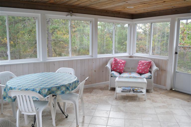 460 Summit Avenue Eastham, MA 02642 - Photo 21 of 25 a living room with a table and chairs