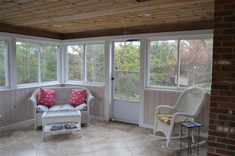 460 Summit Avenue Eastham, MA 02642 - Photo 22 of 25 a living room with furniture and a potted plant