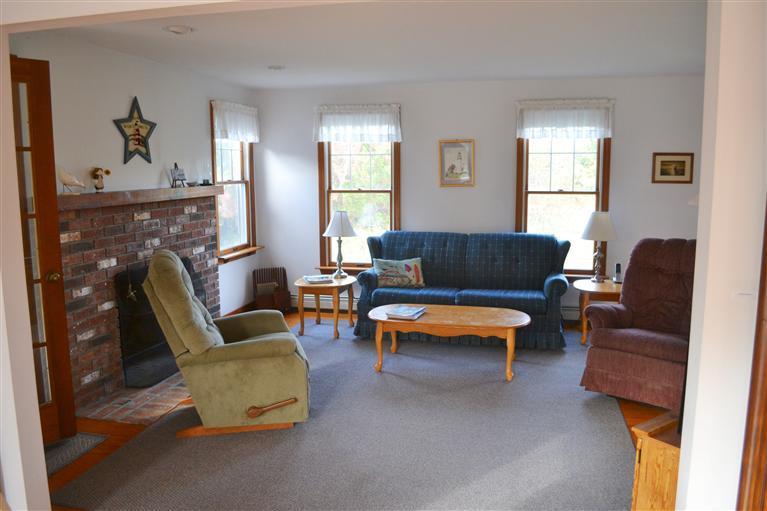 460 Summit Avenue Eastham, MA 02642 - Photo 4 of 25 a living room with furniture and a fireplace