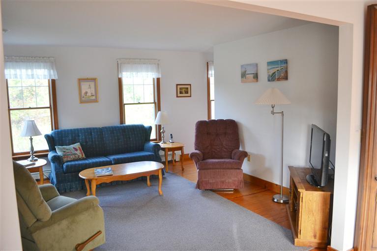 460 Summit Avenue Eastham, MA 02642 - Photo 7 of 25 a living room with furniture and a window