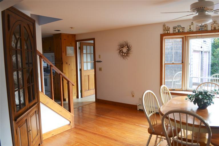 460 Summit Avenue Eastham, MA 02642 - Photo 8 of 25 a view of a hallway with wooden floor and windows