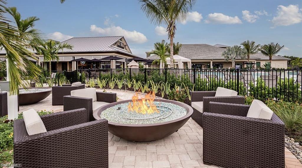 15641 Gavello Street Naples, FL 34114 - Photo 32 of 37 a view of a patio with couches table and chairs