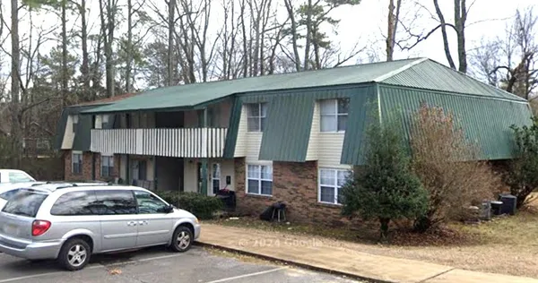 a view of a car park in front of house