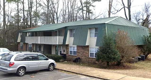 a view of a car park in front of house