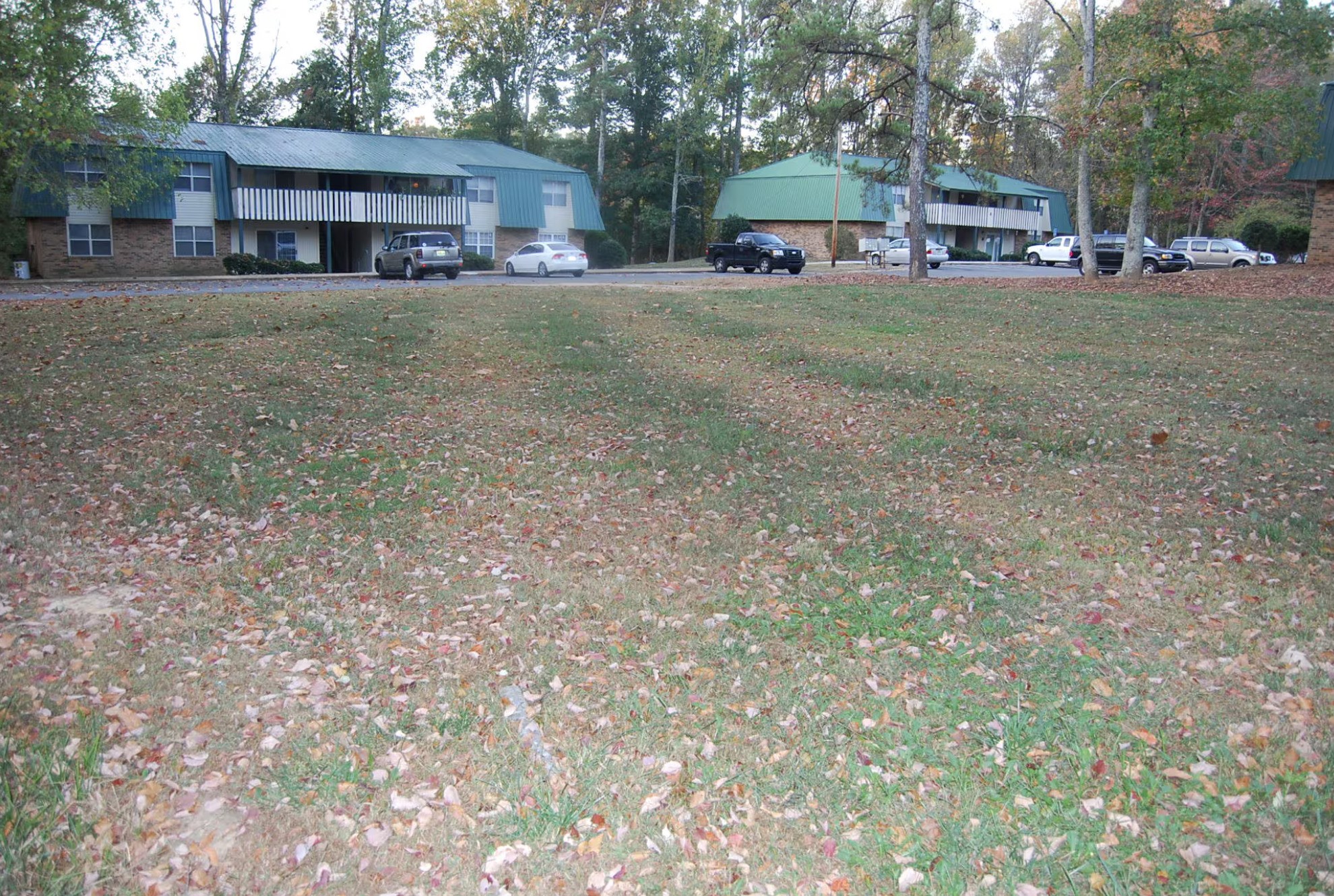 101 Suncrest Drive Grant, AL 35747 - Photo 6 of 6 a front view of a house with a garden and trees