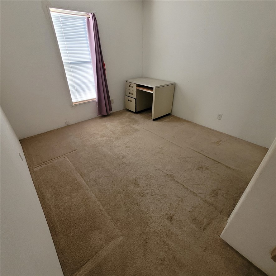9732 2nd Street Chloride, AZ 86431 - Photo 27 of 28 Room with light-colored walls and a window with blinds