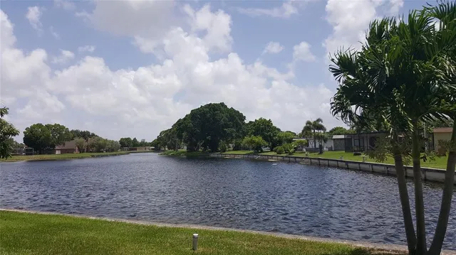 a view of a lake with a big yard