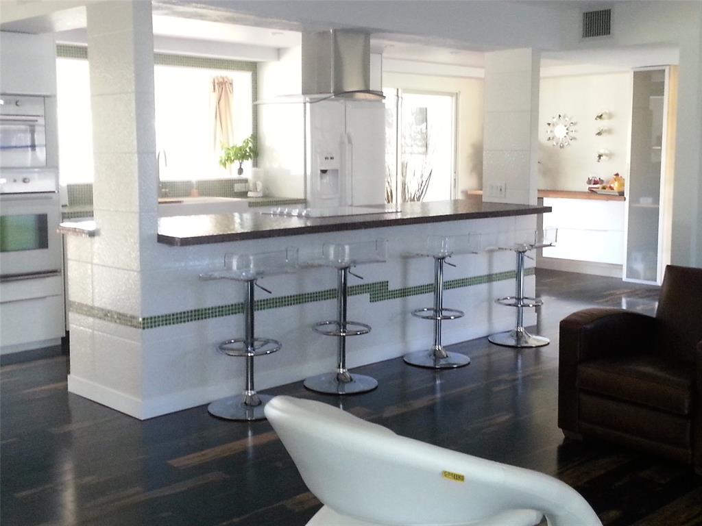 7108 Northwest 66th Street Tamarac, FL 33321 - Photo 5 of 23 a bathroom with a sink and a mirror