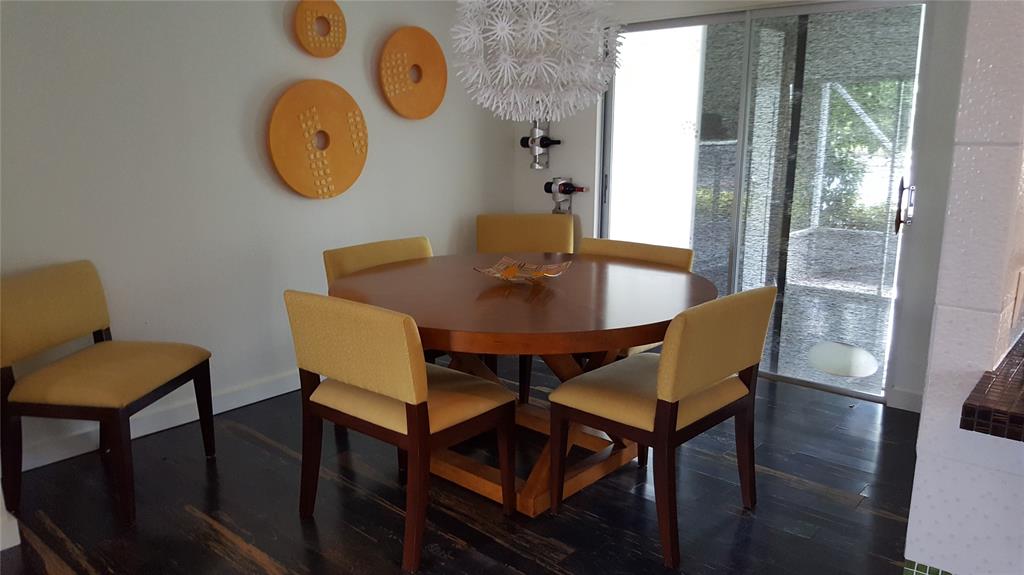 7108 Northwest 66th Street Tamarac, FL 33321 - Photo 6 of 23 a view of a dining room with furniture and a large window