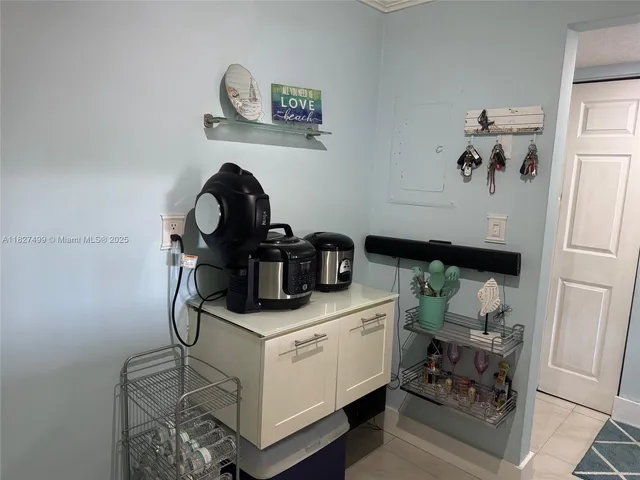 a kitchen with cabinets and appliances