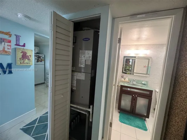 a white toilet sitting next to a shower curtain