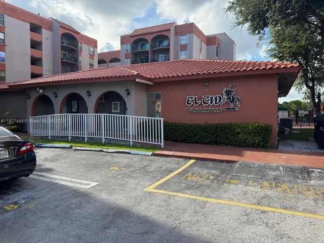 a view of a street with cars