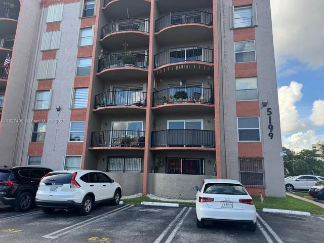 a view of a street with cars