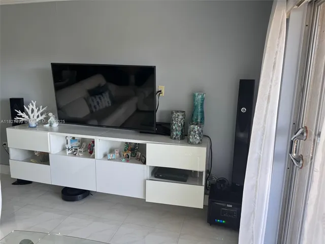 a kitchen with sink a refrigerator and cabinets