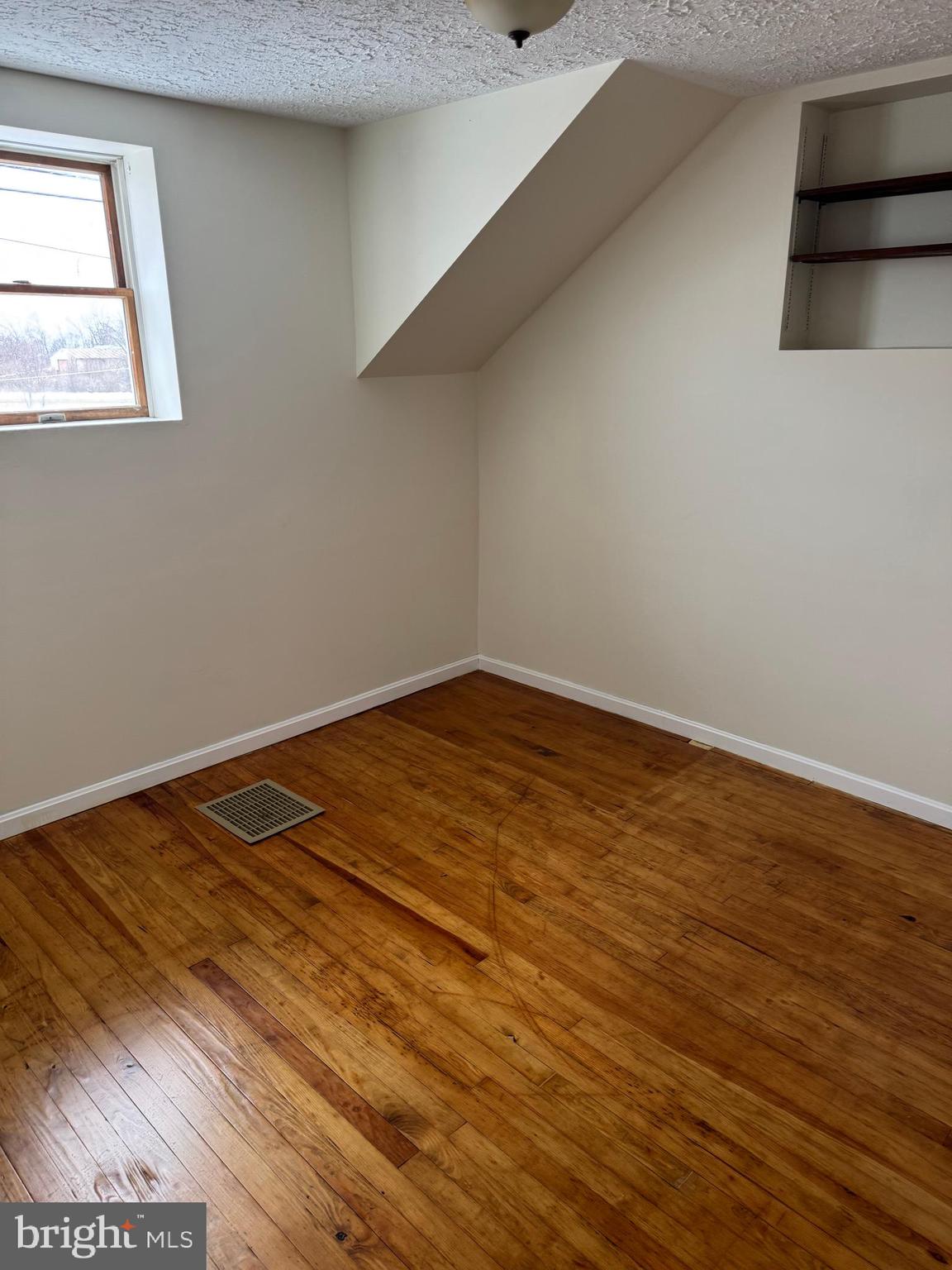 3959 Warm Spring Road Chambersburg, PA 17202 - Photo 12 of 13 a view of a room with wooden floor and more windows