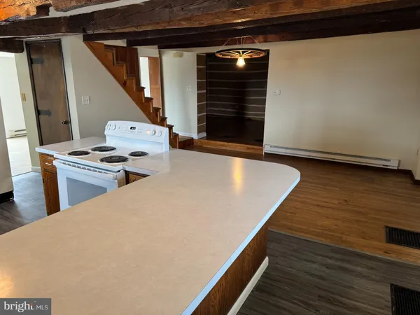 a view of kitchen with wooden floor