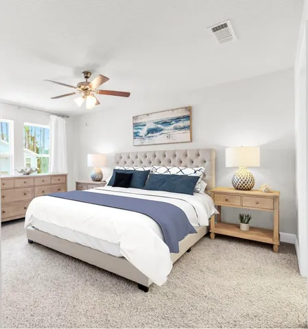 a bedroom with bed and window