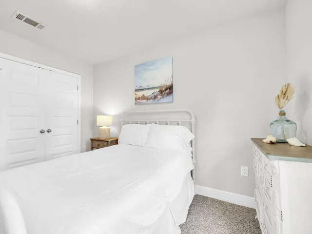 a bedroom with a bed and a table