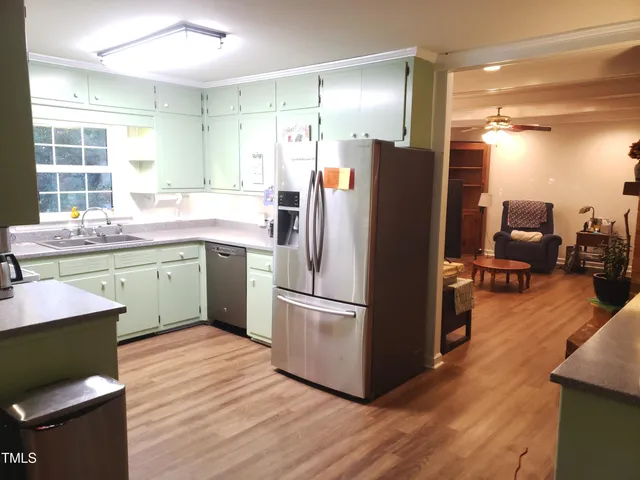 a wall with a clock on it and table