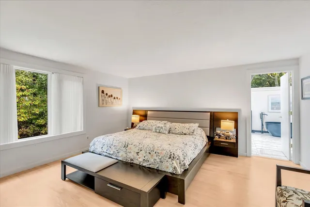 a bedroom with a bed and window