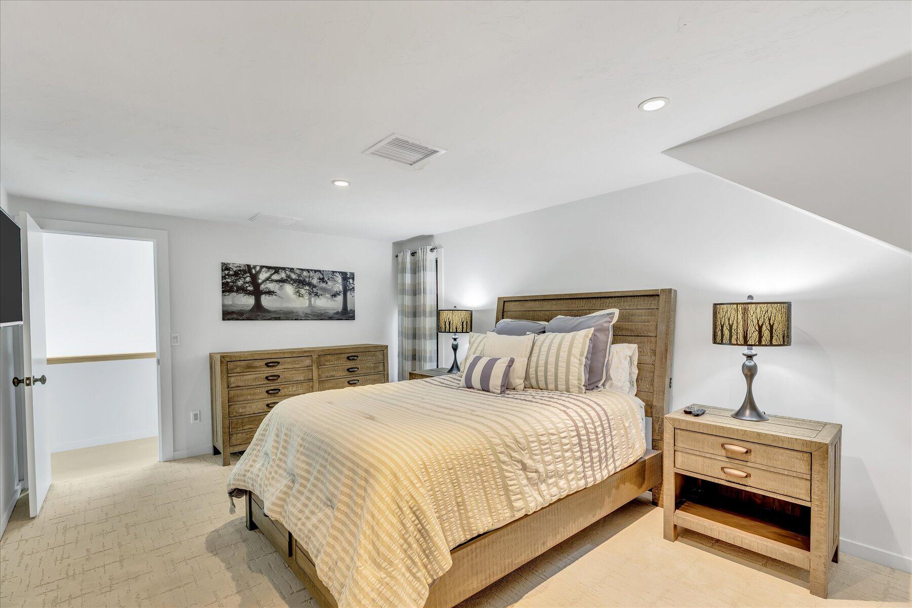 50 Topping Lift Mashpee, MA 02649 - Photo 19 of 32 a bedroom with a bed and a night stand