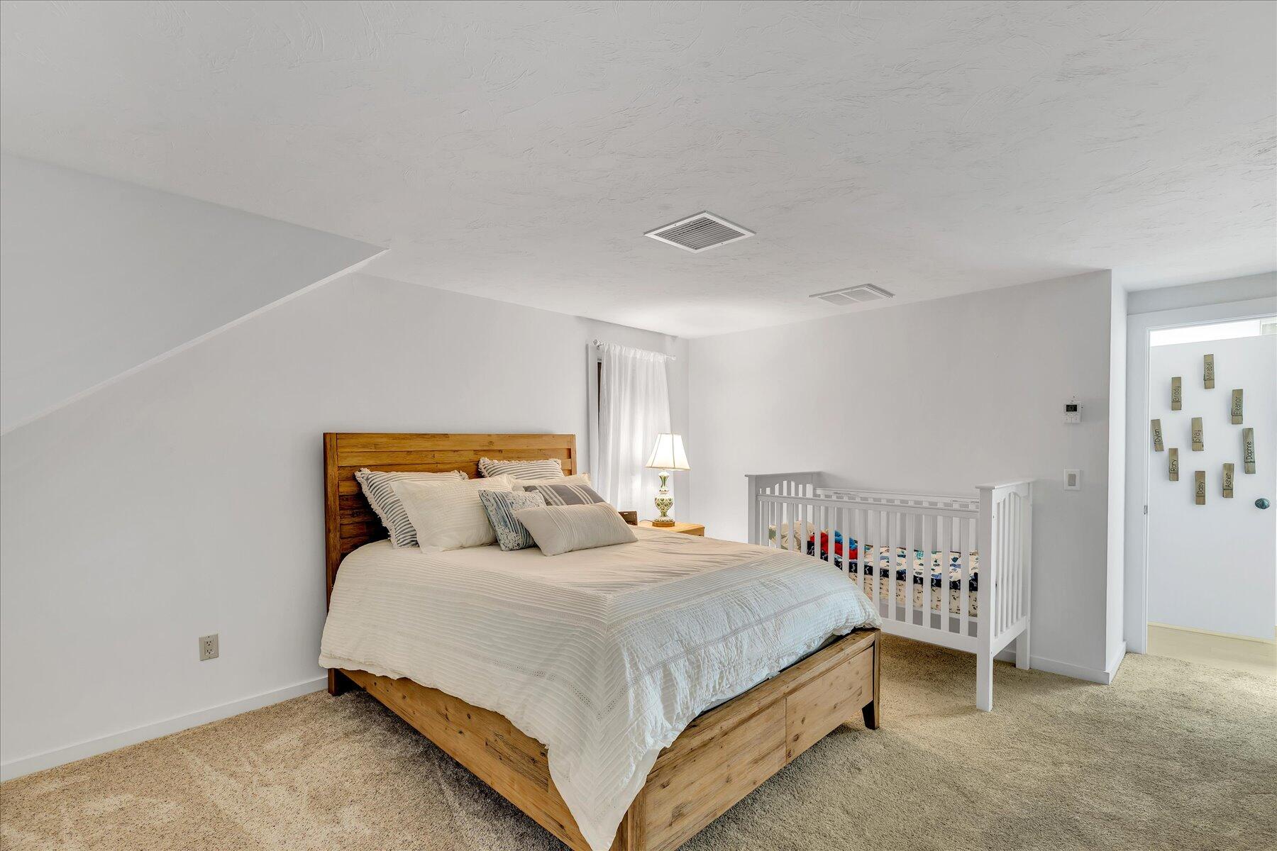 50 Topping Lift Mashpee, MA 02649 - Photo 21 of 32 a bedroom with a bed and a window