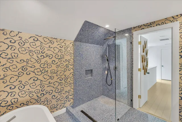 a bathroom with a shower and toilet