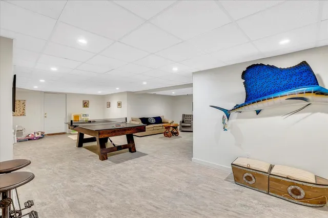 a living room with furniture gym equipment and a view of living room