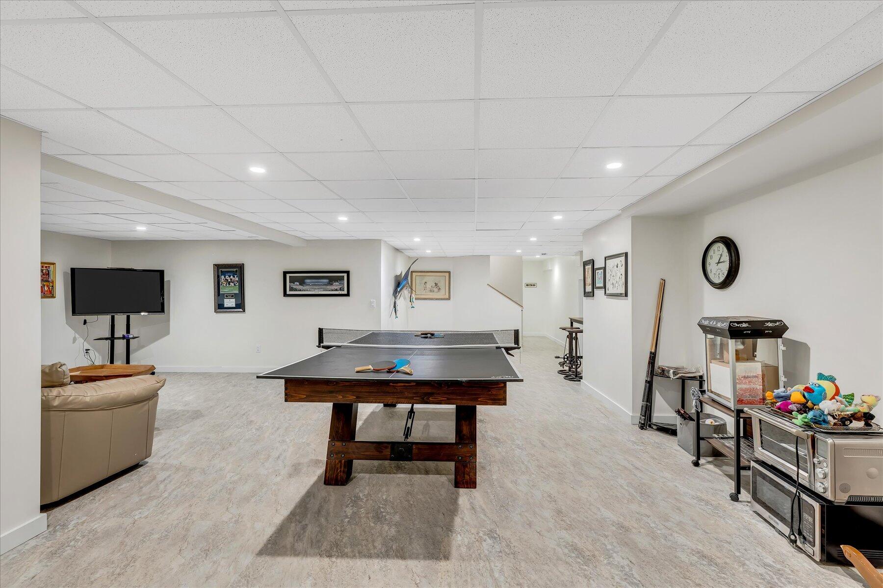 50 Topping Lift Mashpee, MA 02649 - Photo 25 of 32 a living room with furniture and a flat screen tv